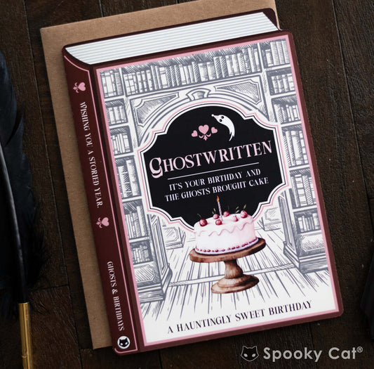 Haunted bookstore–themed book card featuring a pink birthday cake and ghostly decor, perfect for spooky celebrations.