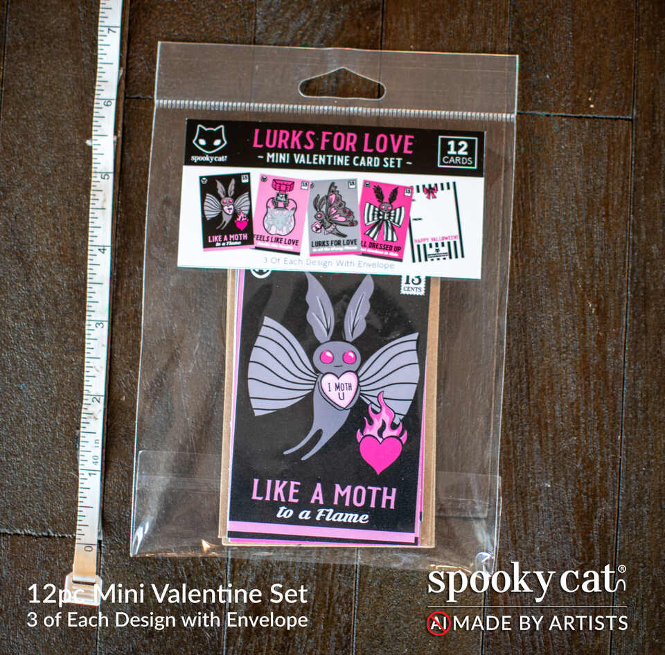 Mothman Valentine’s Set packaged as a 12-piece mini Valentine card set with spooky moth artwork and envelopes by Spooky Cat Press