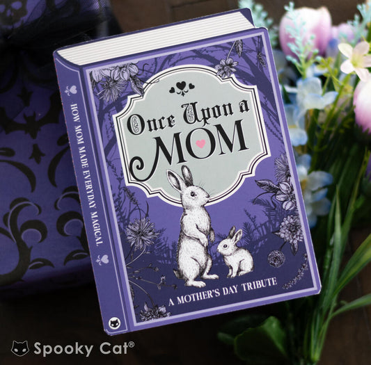 Book-shaped Mother's Day card titled “Once Upon a Mom” with vintage bunny illustration and floral border, styled with flowers and a gothic damask gift wrap