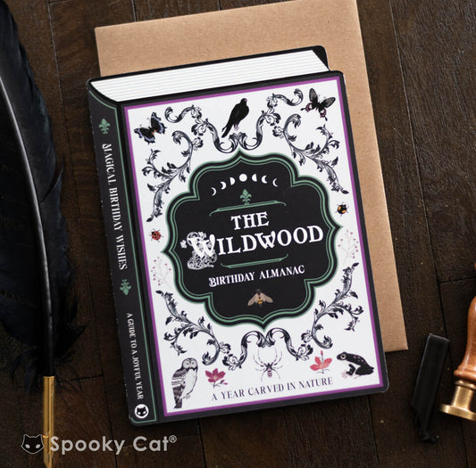 A woodland-themed witch birthday card shaped like a book, with magical creatures, botanical flourishes, and forest-inspired artwork.
