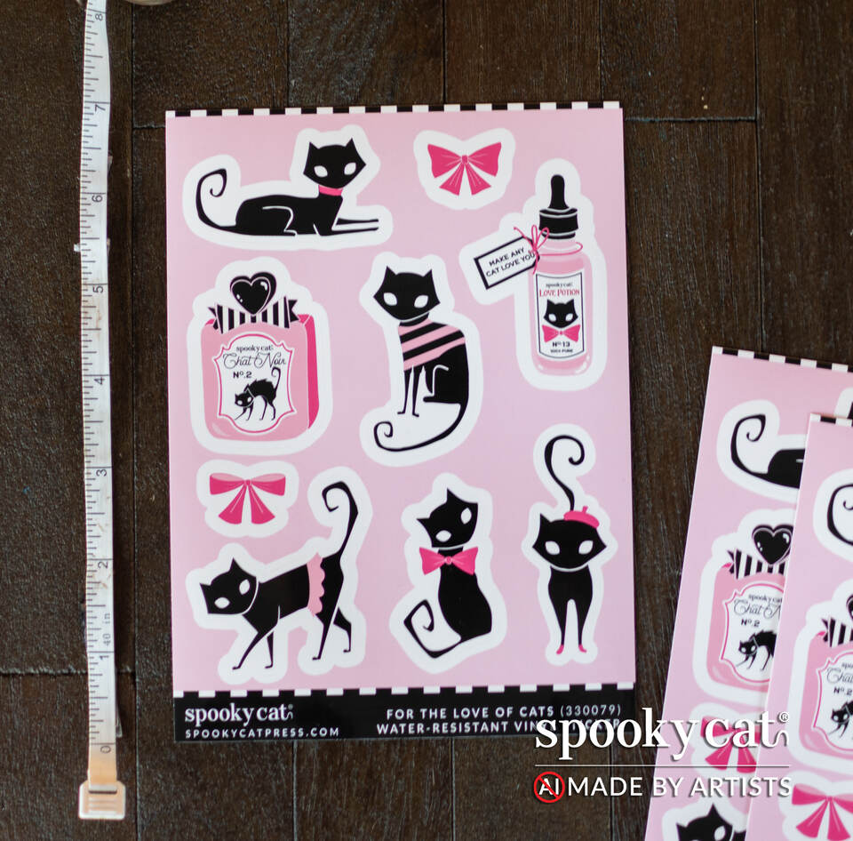 Black Cat Love Vinyl Sticker Sheet featuring spooky black cats, bows, and Valentine-themed designs on a pink background