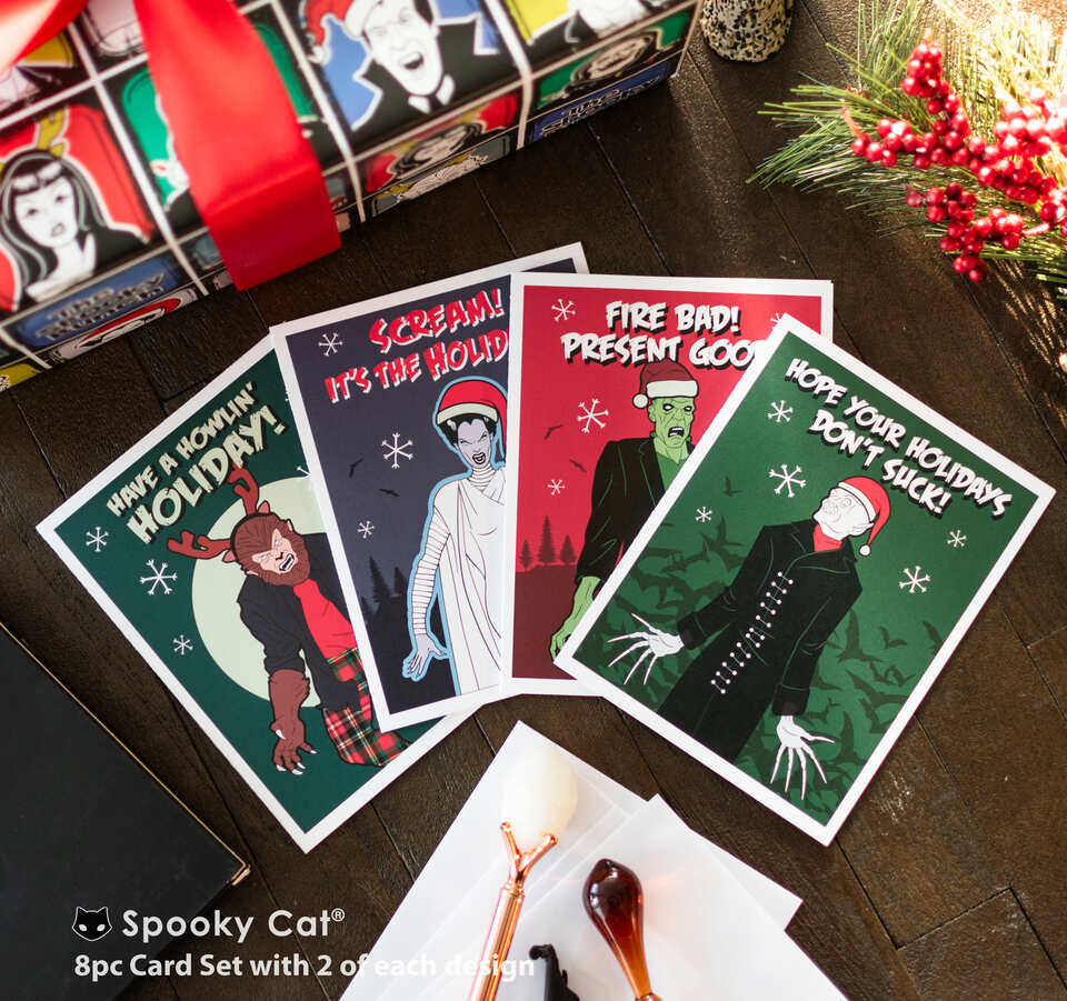 Classic monster horror Christmas cards with Frankenstein, Dracula, Wolfman, and Bride of Frankenstein in festive scenes
