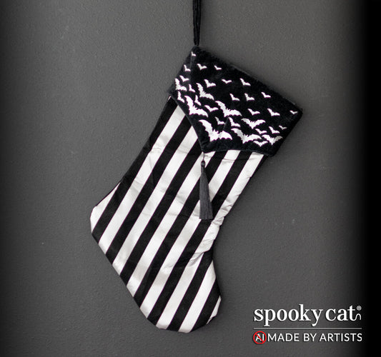 Black and white striped stocking with silver bats and a tassel.