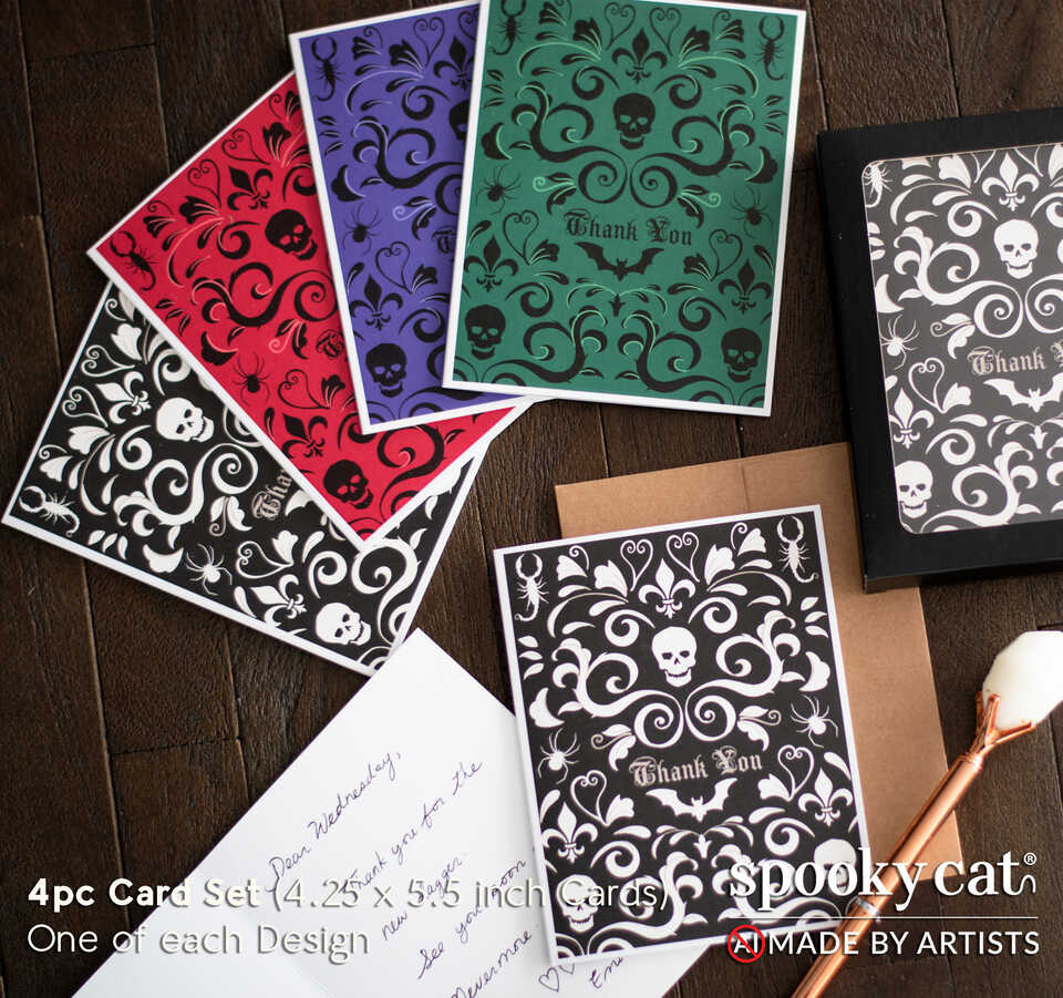 Gothic thank you cards with skull, bat, and spider damask designs in four colors displayed with envelopes and handwritten message.