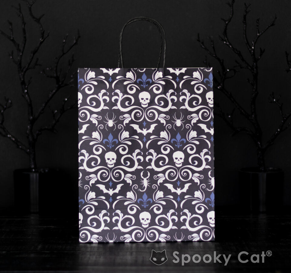 Gothic Damask paper gift bag featuring skulls and bats, thick matte finish, sturdy handles, 12.5 by 9.75 by 4.75 inches.