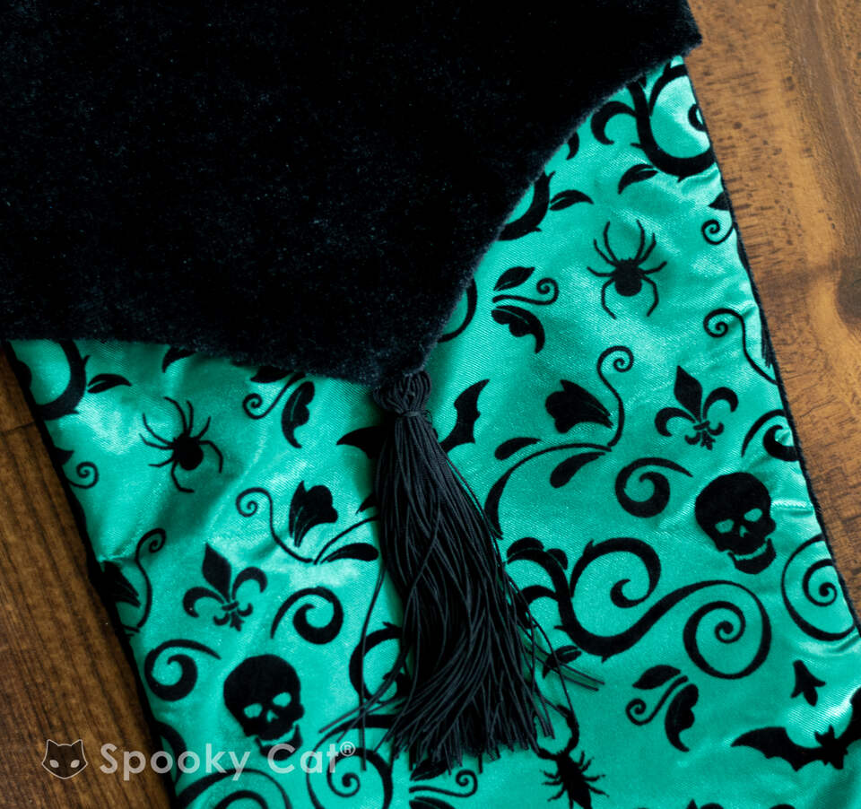Green Gothic Christmas stocking with silver skull, bat, and swirl damask
