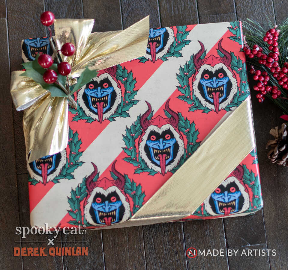 Christmas present wrapped in Krampus Wreath Creepmas gift wrap featuring red and cream stripes, blue Krampus faces, holly wreaths and a gold ribbon.
