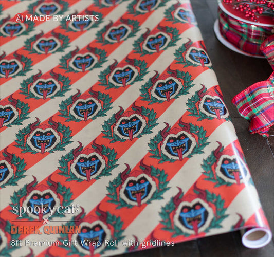 Close-up of Krampus Christmas gift wrap roll with repeating horned Krampus illustrations, holly wreaths and vintage red and cream candy cane stripes.