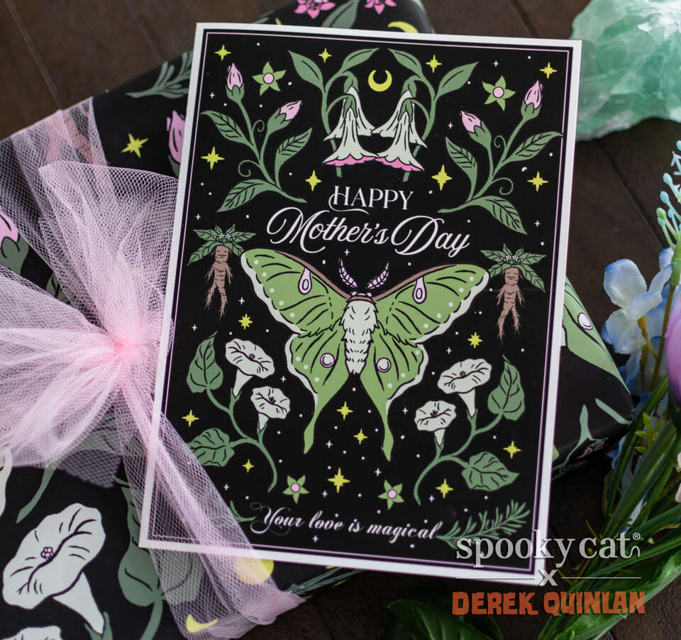 Luna moth Mother’s Day card styled with tulle and matching floral fabric, featuring green moth and botanical design on black background