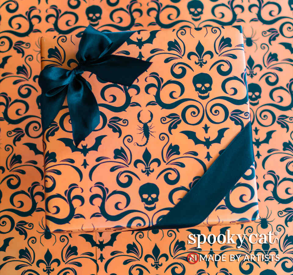 Gift wrapped in Orange Gothic Damask wrapping paper featuring  black skull and bat damask design on an orange background tied with black ribbon.