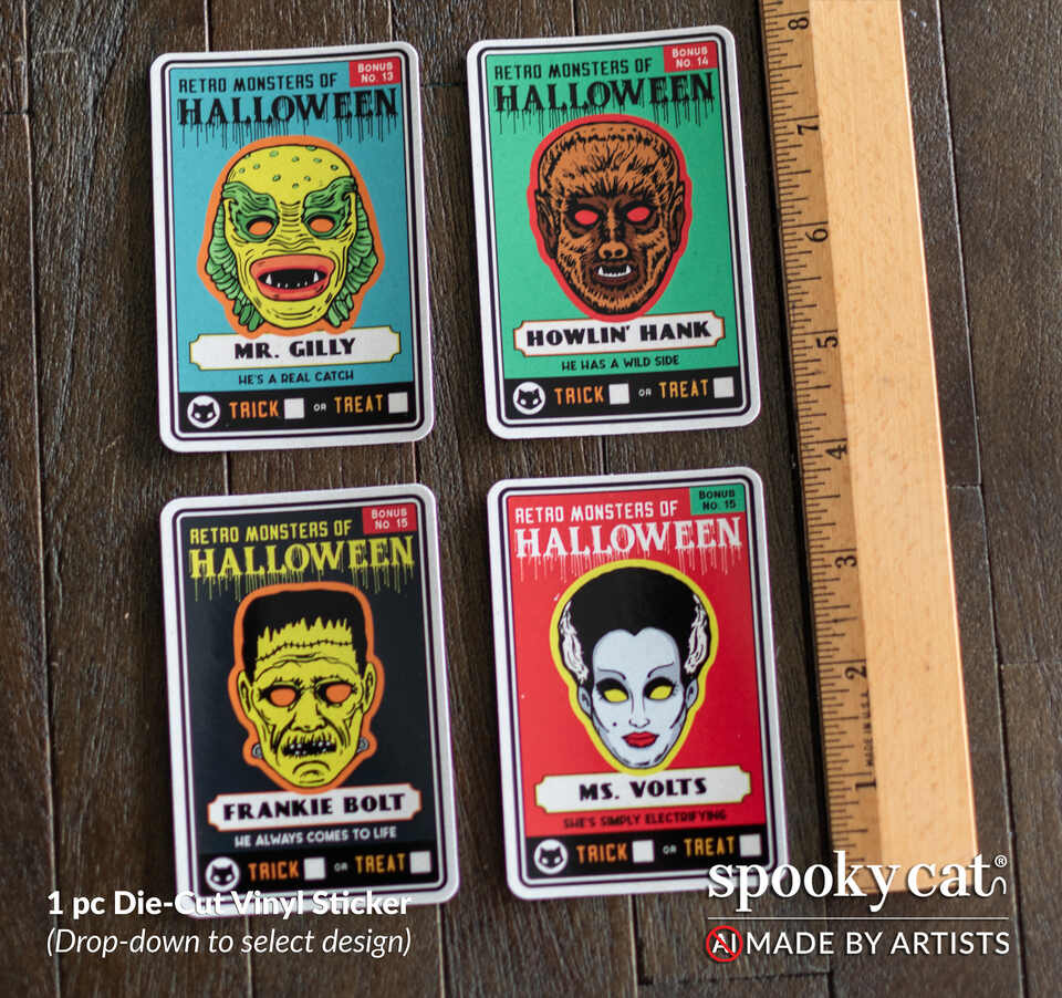 Four Halloween die-cut vinyl stickers featuring retro monster designs laid out on a dark wood surface next to a wooden ruler for scale. The stickers look like vintage classic monster trading cards