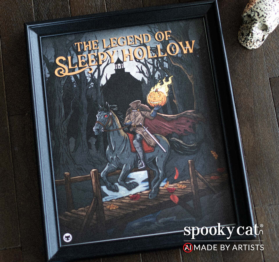 An 8x10 Halloween art print with Sleepy Hollow inspired art. The headless horseman is shown on horseback on a bridge scattered with fall leaves. Art print is show in a black frame on a dark wood surface. A skull is partially visible in the background, and the Spooky Cat brand logo appears in the bottom right corner with the text NO AI, made by artists.