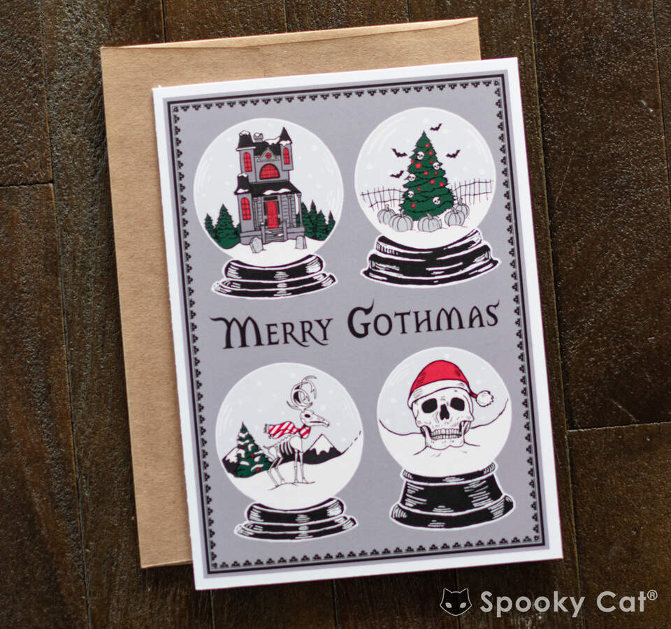 Gothic Christmas greeting card showing eerie snow globe designs with a haunted holiday theme.