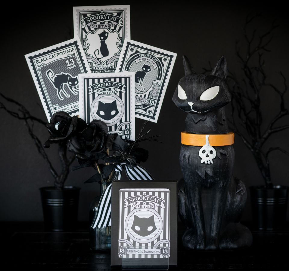 Four Spooky Cat Postage black cat greeting cards with kraft envelopes featuring vintage postage stamp style cat illustrations.