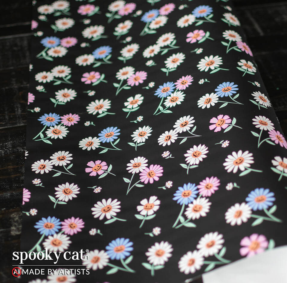 Flat view of Springoween gift wrap showing repeating pastel daisies with orange jack o lantern faces on black background.