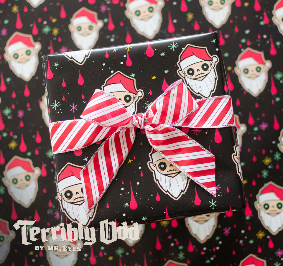 Santa Orli Creepmas wrapping paper by artist Michael Reyes featuring creepy Santa faces, colorful retro starbursts and red accents on black.
