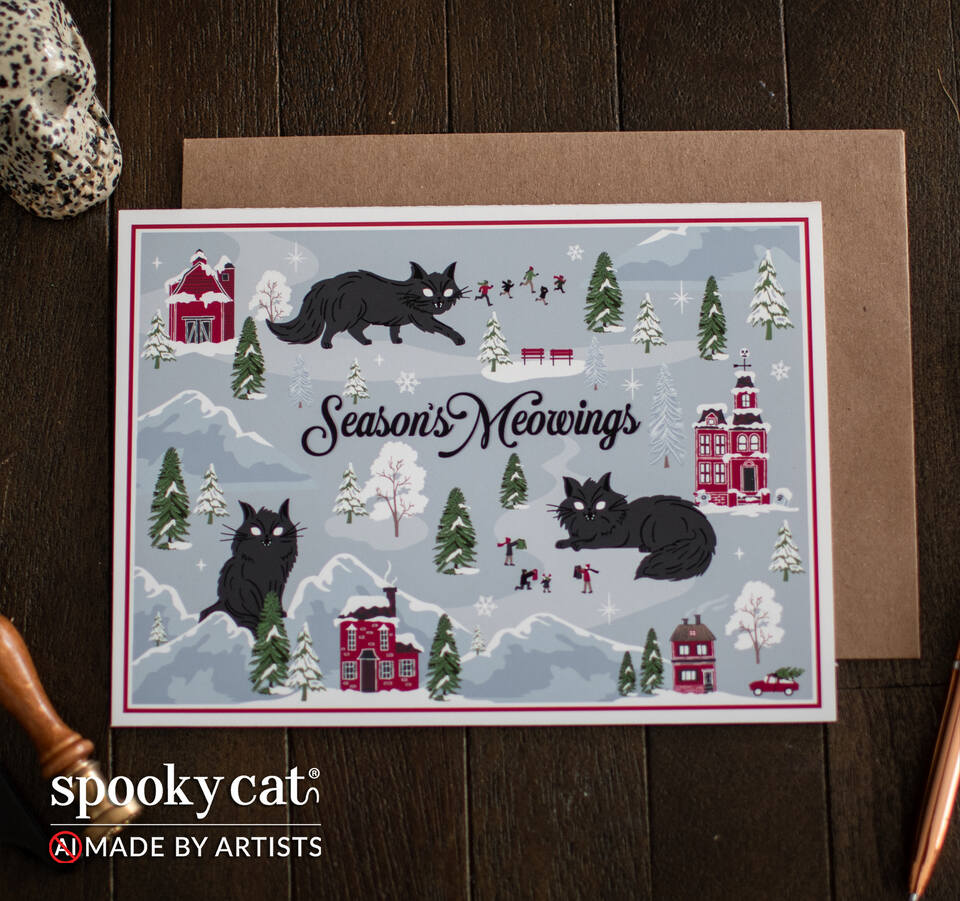 Creepmas greeting card reading “Season's Meowings” featuring Jólakötturinn, snowy Nordic villages, red houses and evergreen trees, displayed in front of a kraft envelope on a dark wood background. Text shows spooky cat logo. No AI. Made By Artists.